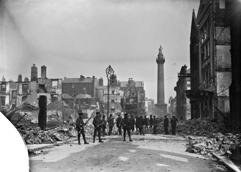 [Henry Street shelled, Nelson's Pillar, workmen clearing rubble, soldiers holding guns]