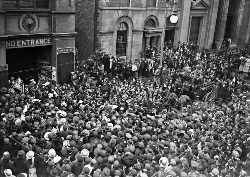 [Released prisoners outside Pearse Station, crowds, taken from elevated vantage point]