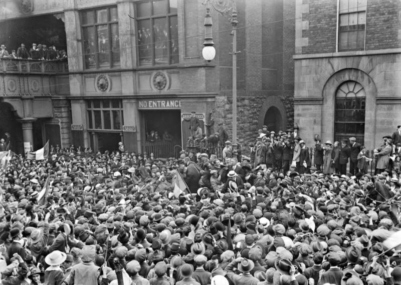 [Entrance to Pearse Station, crowds surround released prisoners]