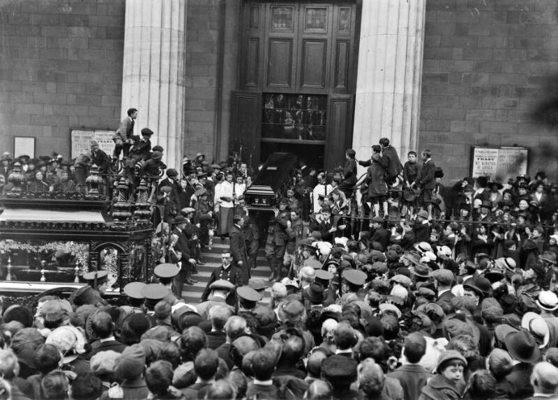 [Funeral of O'Donovan Rossa, removal of remains from the Pro Cathedral, coffin at entrance, hearse awaits, crowds]