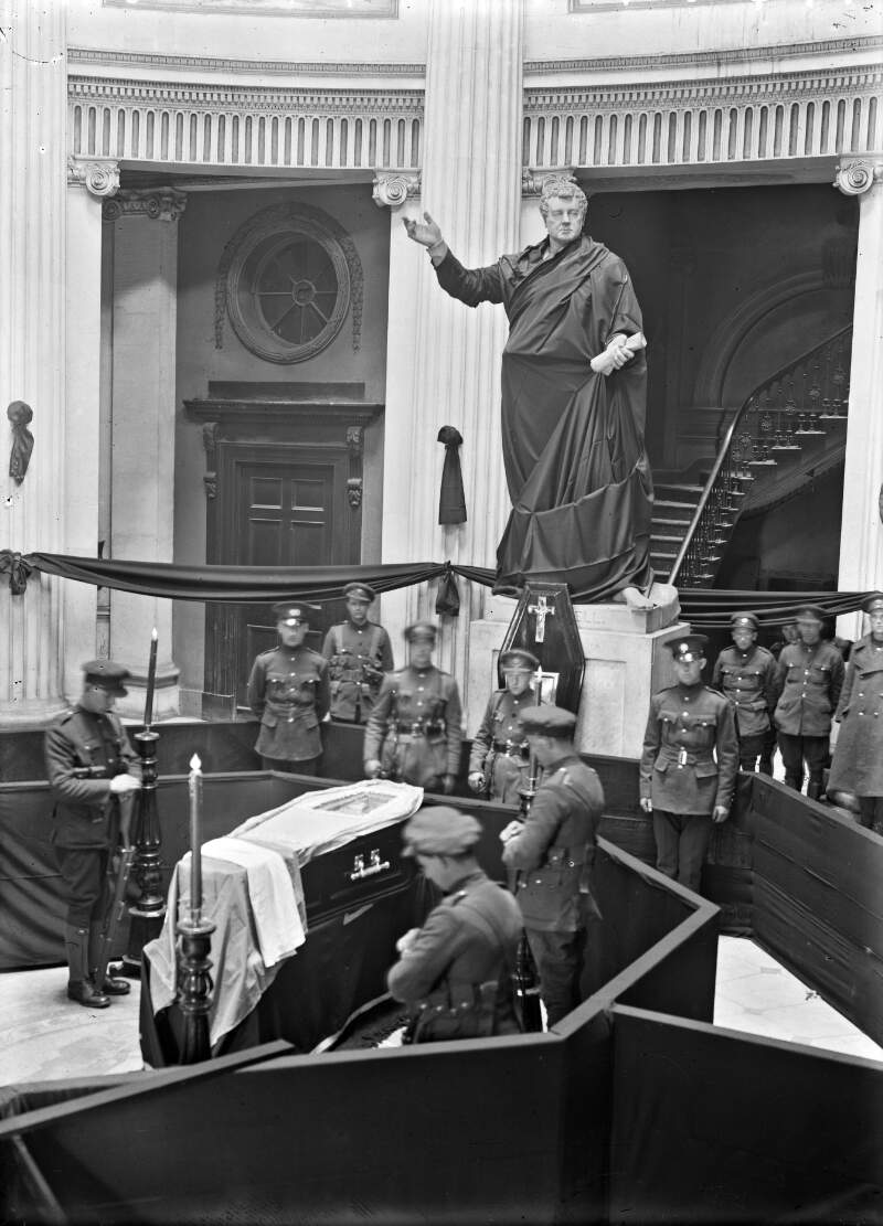 [Funeral of O'Donovan Rossa, lying-in-state in the City Hall, tricolour on the coffin, Statue of Daniel O'Connell draped in black]