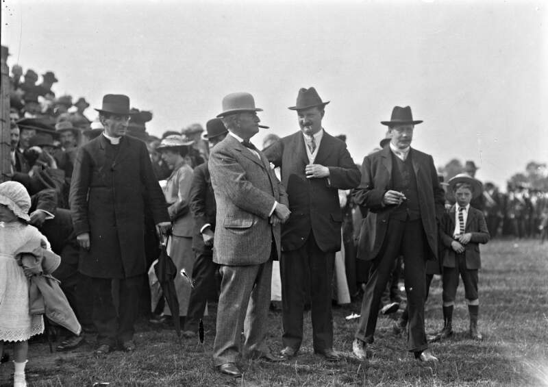 [John Redmond, his younger brother William Hoey Kearney and his eldest son William Archer and others, at Irishmen convention, taken outdoors]