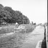 [Man steering barge on Grand Canal, Portobello/Ballsbridge, Dublin]