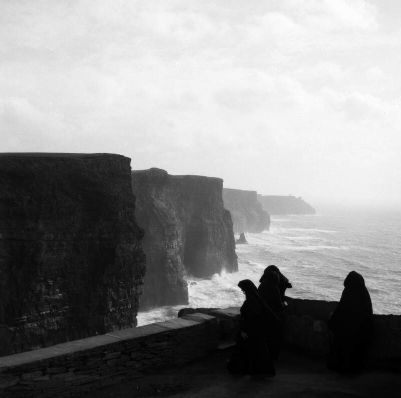 [Three nuns at the Cliffs of Moher, Co. Clare]
