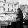 [Nun at vegetable stall, Moore Street Market, Dublin]