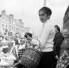 [Woman with shopping basket, Moore Street Market, Dublin]