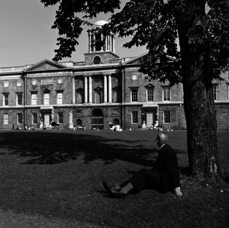 [Man seated under tree in grounds of King's Inns, Henrietta Street, Dublin]