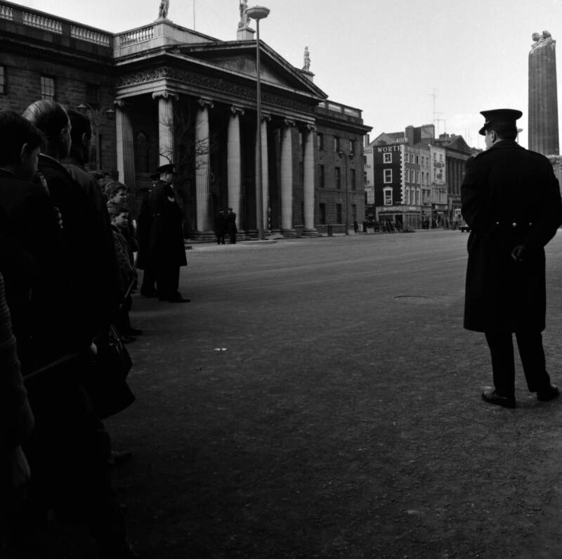 [Crowd and guards at demolition of Nelson Pillar, G.P.O in background, O'Connell Street, Dublin]