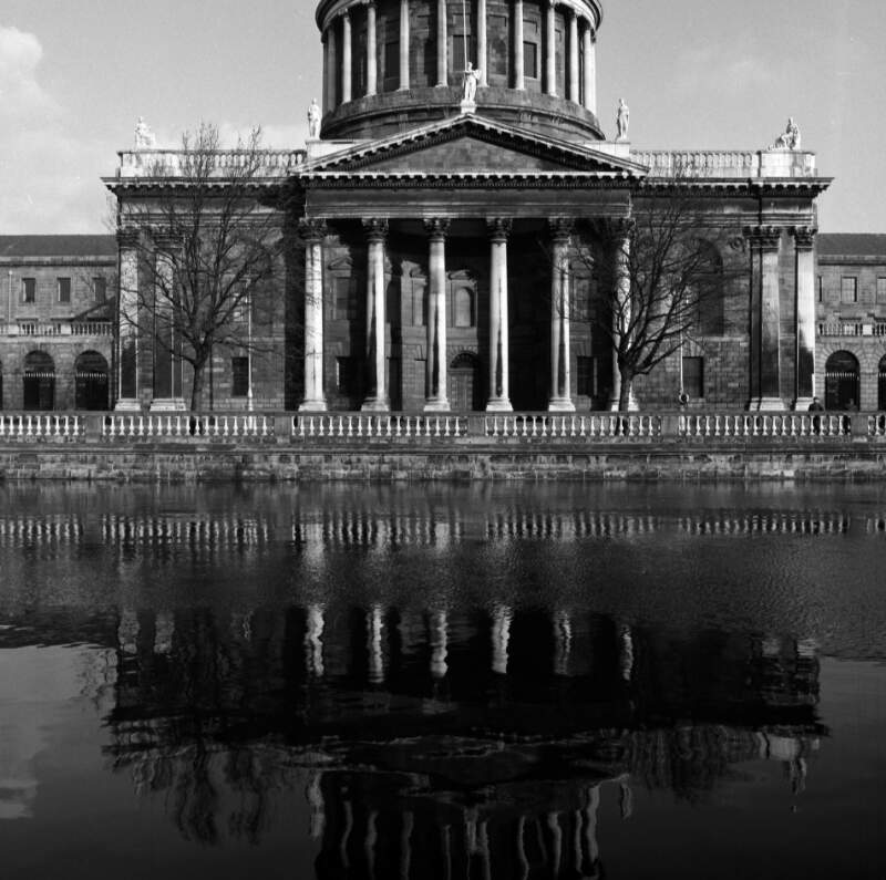 [View of Four Courts from Merchants Quay, also shows reflection in River Liffey, Dublin]