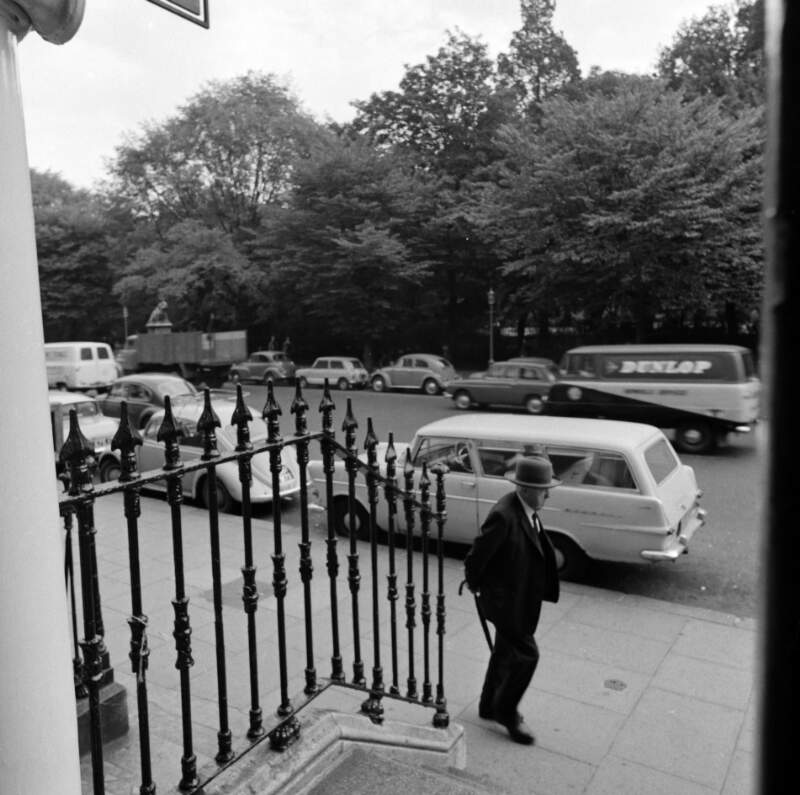 [View from doorway showing traffic and pedestrian, St. Stephen's Green, Dublin]