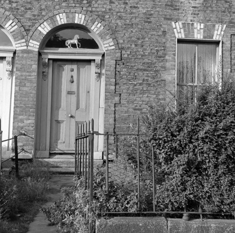 [Doorways with "white-horse" ornaments in fanlights, Upper Grand Canal Street, Dublin]