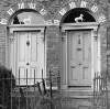 [Doorways with "white horse" ornaments in fanlights, Upper Grand Canal Street, Dublin]
