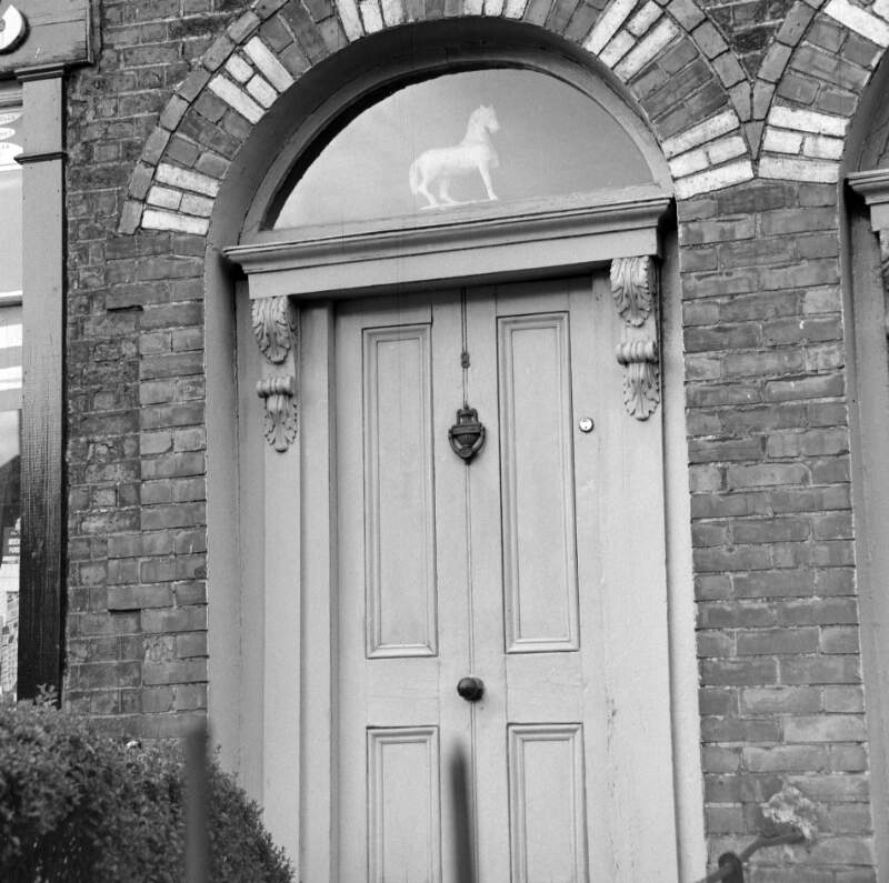 [Doorway with "white horse" ornament in fanlight, Upper Grand Canal Street, Dublin]
