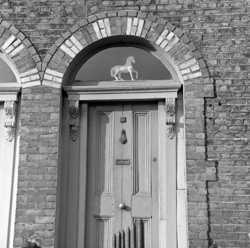 [Doorway with "white horse" ornament in fanlight, Grand Canal Street Upper, Dublin]