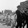 [Band marching with communion girls, Corpus Christi procession, Church Street area, Dublin]