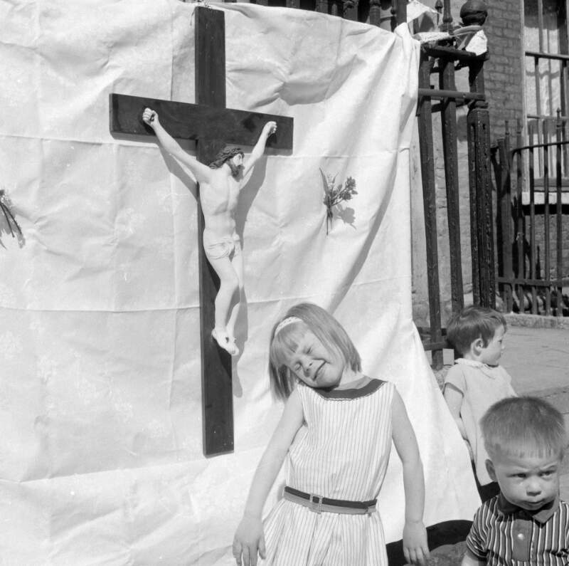 [Little boy and girl in front of large crucifix, Corpus Christi, Henrietta Street, Dublin]