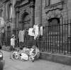 [Children selling secondhand clothes at St. Catherine's Church, Thomas Street, Dublin]