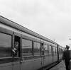 [Boy leaning out of train, guard on platform, Heuston (Kingsbridge) Station, Dublin]