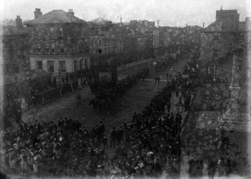 [Spectators lining streets to view St. Patrick's day parade, Ireland]