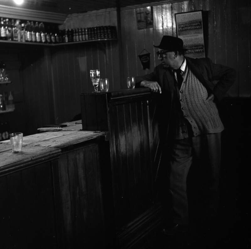 [Patrick Kavanagh leaning on bar in public house, Inniskeen, Co. Monaghan]