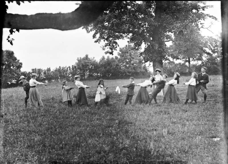 [Adults and children playing tug of war, Drumleck, Co. Louth]