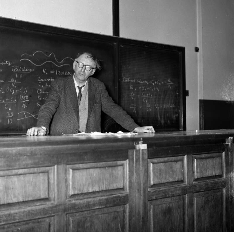 [Patrick Kavanagh giving poetry lecture, two hands resting on table, University College Dublin]