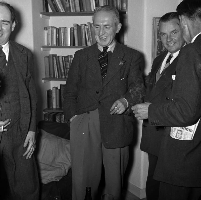 [Flann O'Brien, Tom Joyce and two unidentified men, Bloomsday at Michael Scott's house, Sandycove, Co. Dublin]