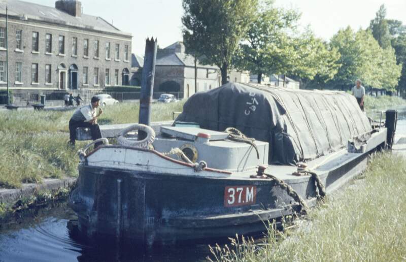 [Barge going through lock gate on Grand Canal, houses in background, Portobello, Dublin]