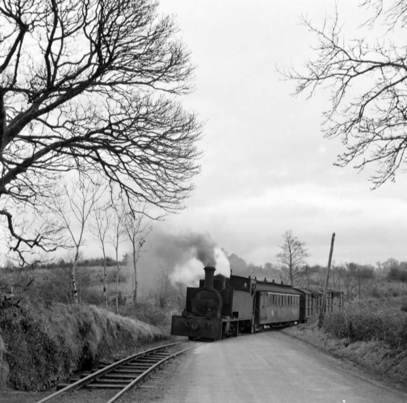 [Steam train crossing roadside track at Kiltubbrid, Co. Leitrim]