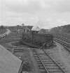 [Man pushing steam train on a turn table, Kilfree Junction, Co. Sligo]