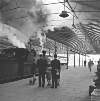 [People waiting on a railway platform at Kingsbridge station as a steam train arrives, Dublin]