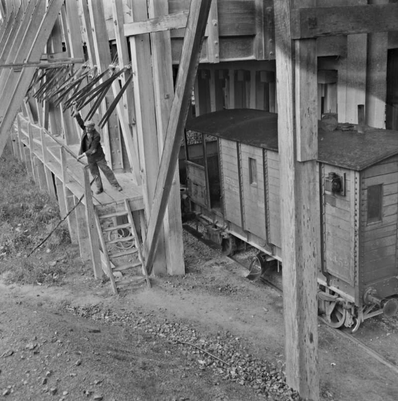 [Man operating stone chute at Lisduff stone plant, Co. Laois]