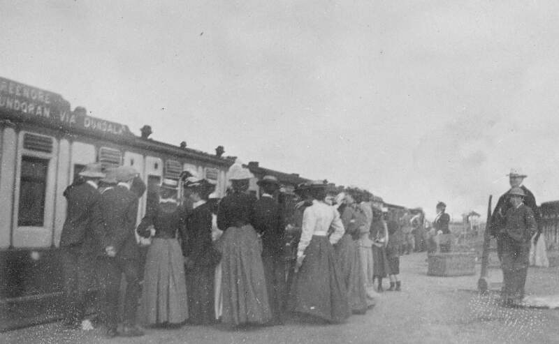 [People gathering on a station platform to board the train to Bundoran]
