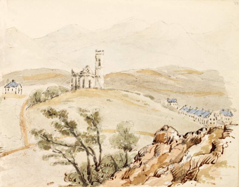[View of a church with round tower on a hill overlooking a village below]