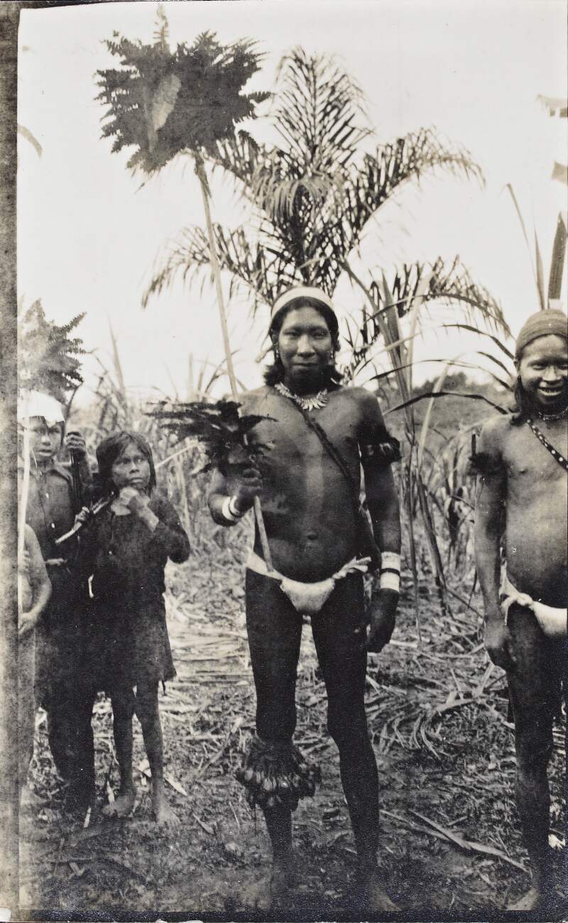 [Man holding a spear, surrounded by onlookers, in the Putumayo region]