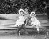 [Edith and Ethel Dillon with dog on garden bench, Clonbrock House, Ahascragh, Co. Galway]