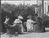 [Group of four adults relaxing in Clonbrock garden, including Edward Crofton, Augusta Caroline Dillon and Edith Dillon]