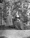 [Portrait of two servant girls, identified as Pat Dolan's daughters, at back of Clonbrock House, Co.Galway]