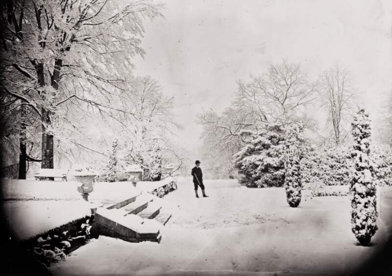 [Man holding rifle in snow-covered Clonbrock garden, Ahascragh, Co. Galway, December 1870]