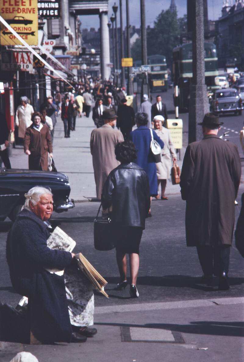 [Woman selling newspapers, O'Connell Street, Dublin]