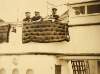 [National Army troops boarding a ship, holding a mattress]