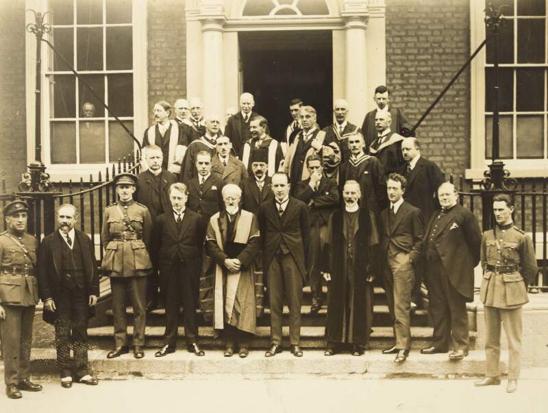 [Group outside 19 Dawson Street [headquarters of the Royal Irish Academy], including Eoin O'Duffy, Kevin O'Higgins, William T. Cosgrave, Desmond FitzGerald, Chief Justice Kennedy and W.B. Yeats ( 1924)]