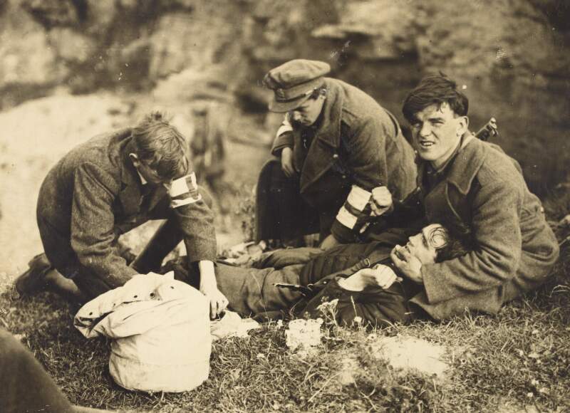 [Injured soldier being helped by the Red Cross at the South Western Front during the Irish Civil War]