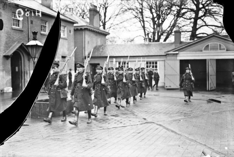 [Soldiers marching in barracks]