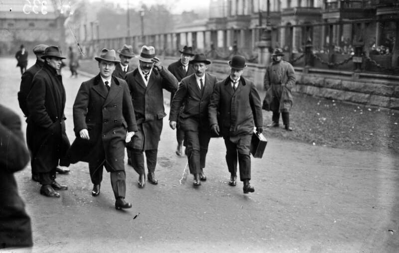 [Group arriving at Earlsfort Terrace for an Election meeting]