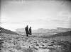 [Couple standing on Croagh Patrick looking out at Clew Bay]