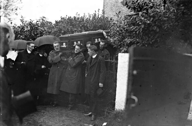 [Funeral of Cardinal Patrick O'Donnell, coffin being carried into graveyard.]