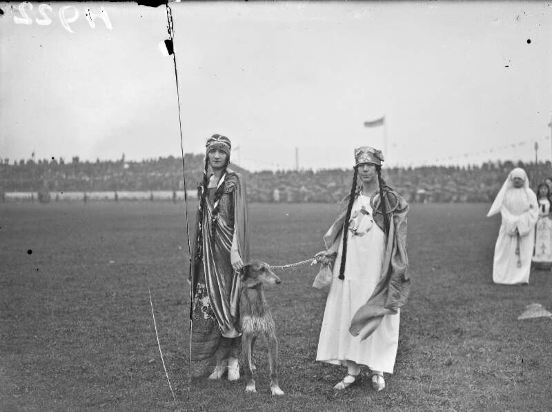[Tailteann Games 1928. Opening ceremony. Two women in ancient Irish style costume with wolfhound]