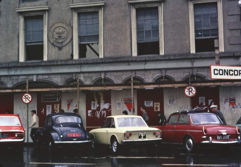[Cars parked along the front of the City of Dublin Steam Packet Building]