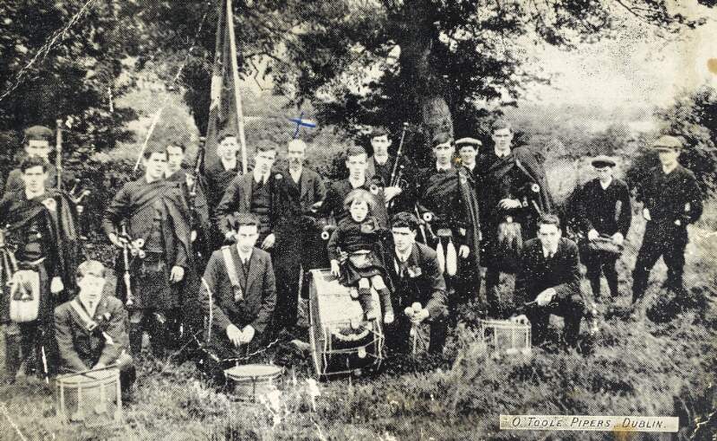 [Group portrait of bandsmen, from St. Laurence O'Toole Pipers Band featuring Tom Clarke]